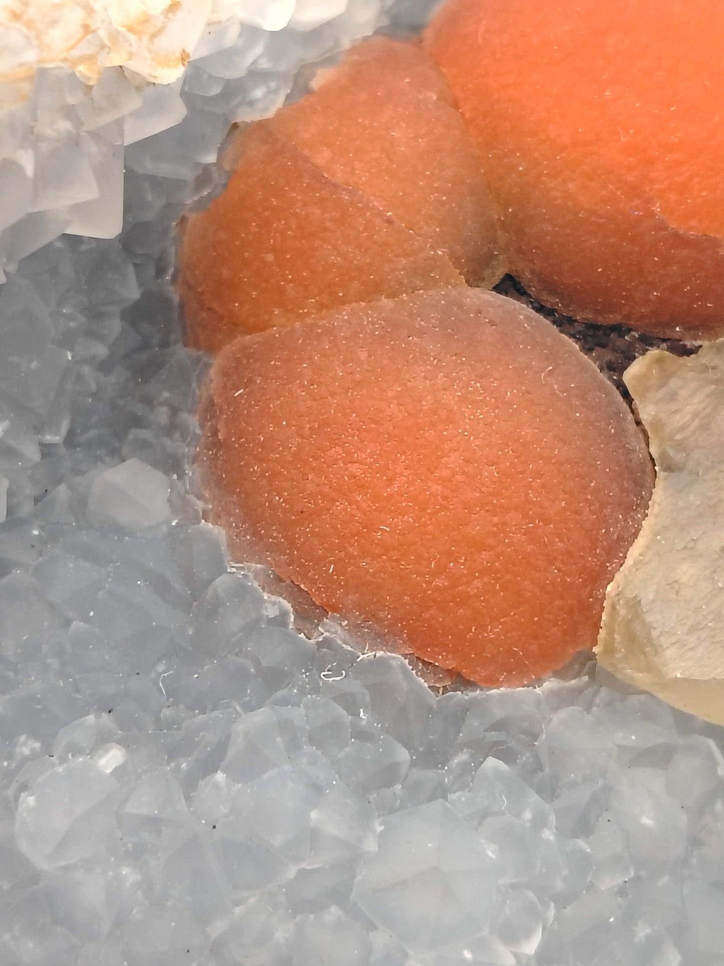 Red Fluorite Spheres and Calcite on Quartz