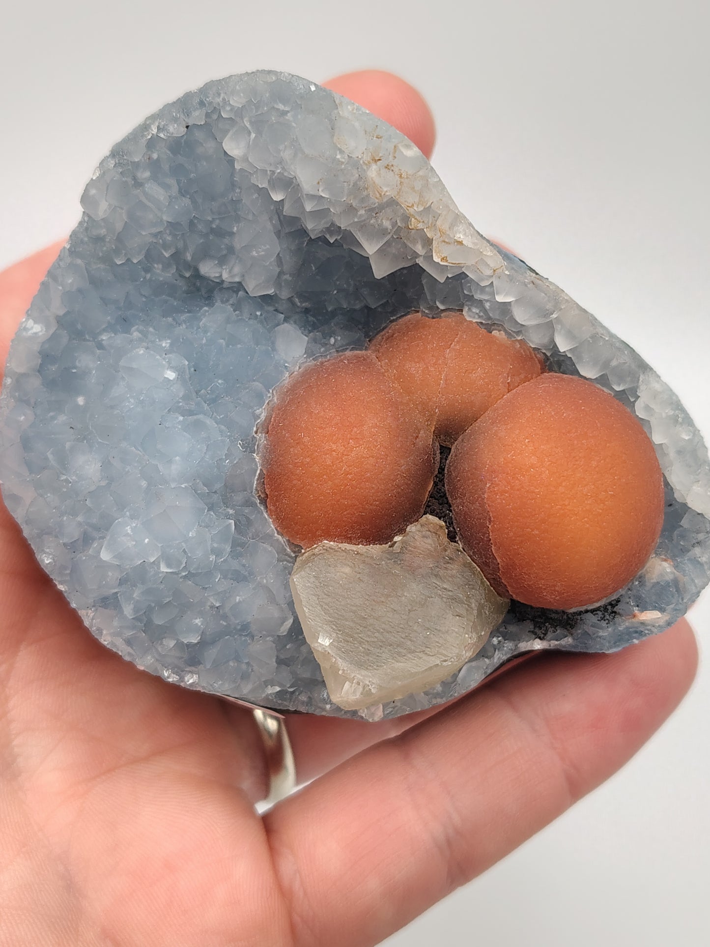 Red Fluorite Spheres and Calcite on Quartz